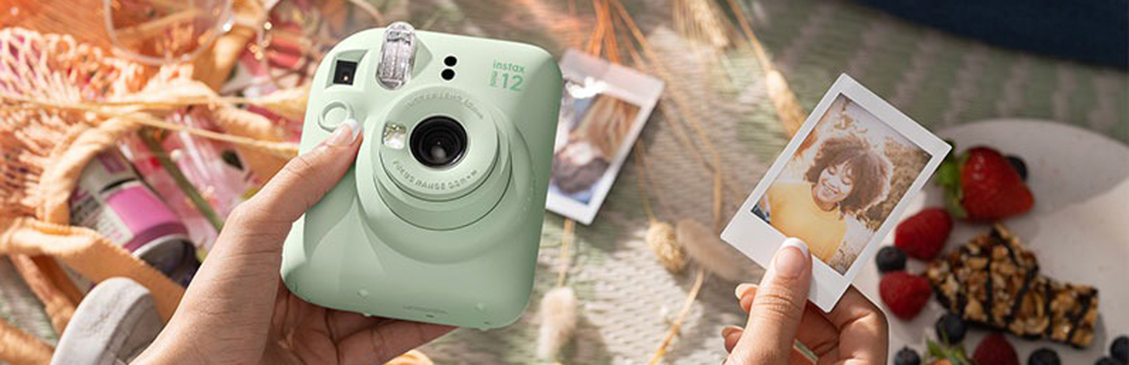 Guests capturing moments with a Fujifilm Instax camera at an event